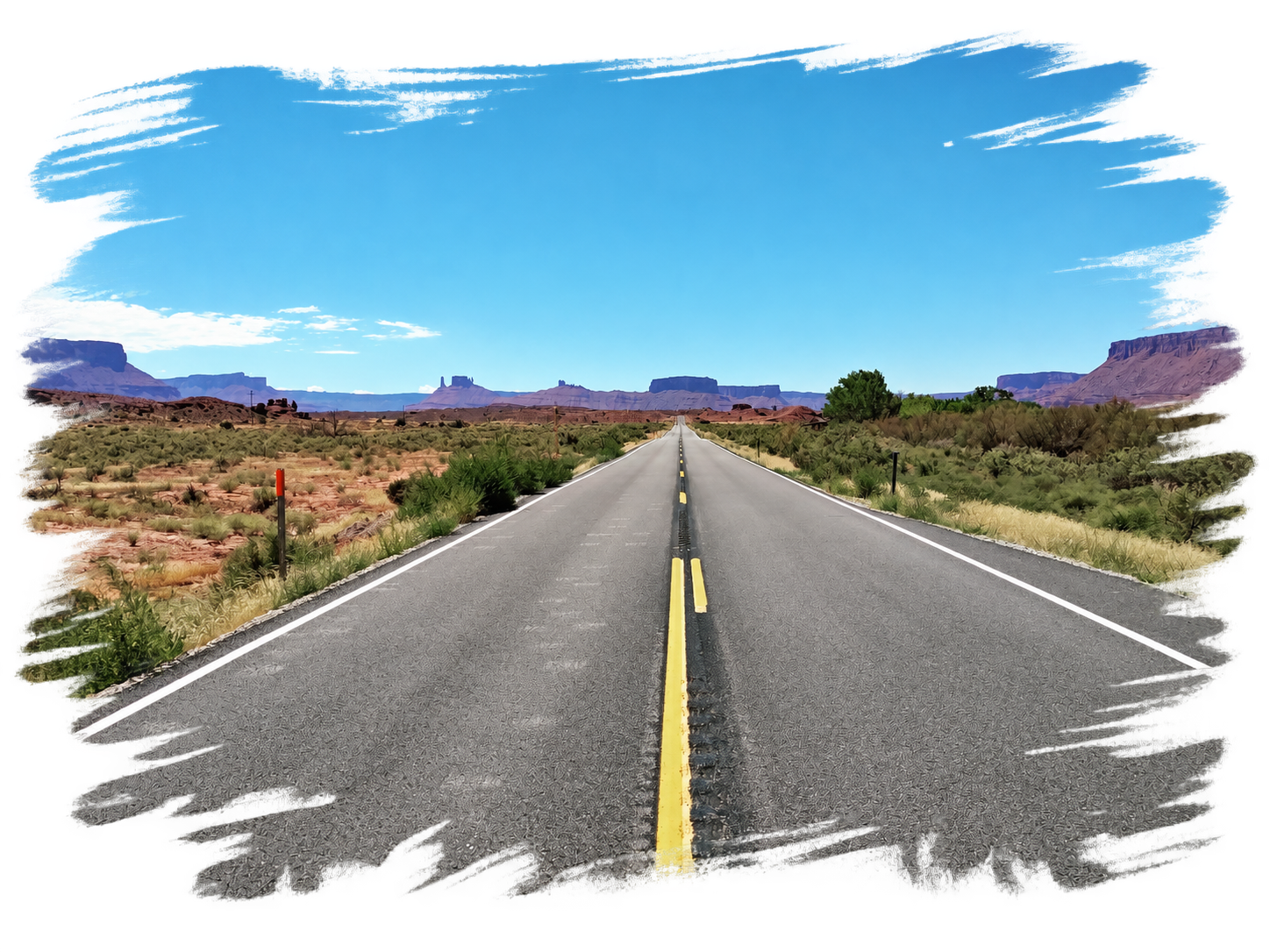A road winding through a red rock desert landscape
